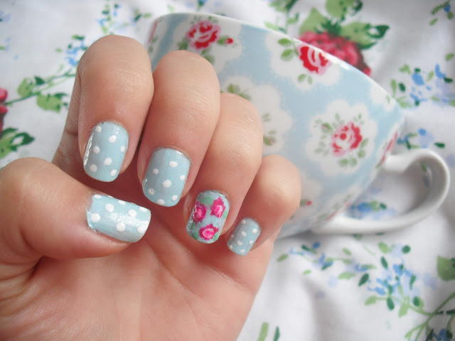 Pastel blue flower nail design