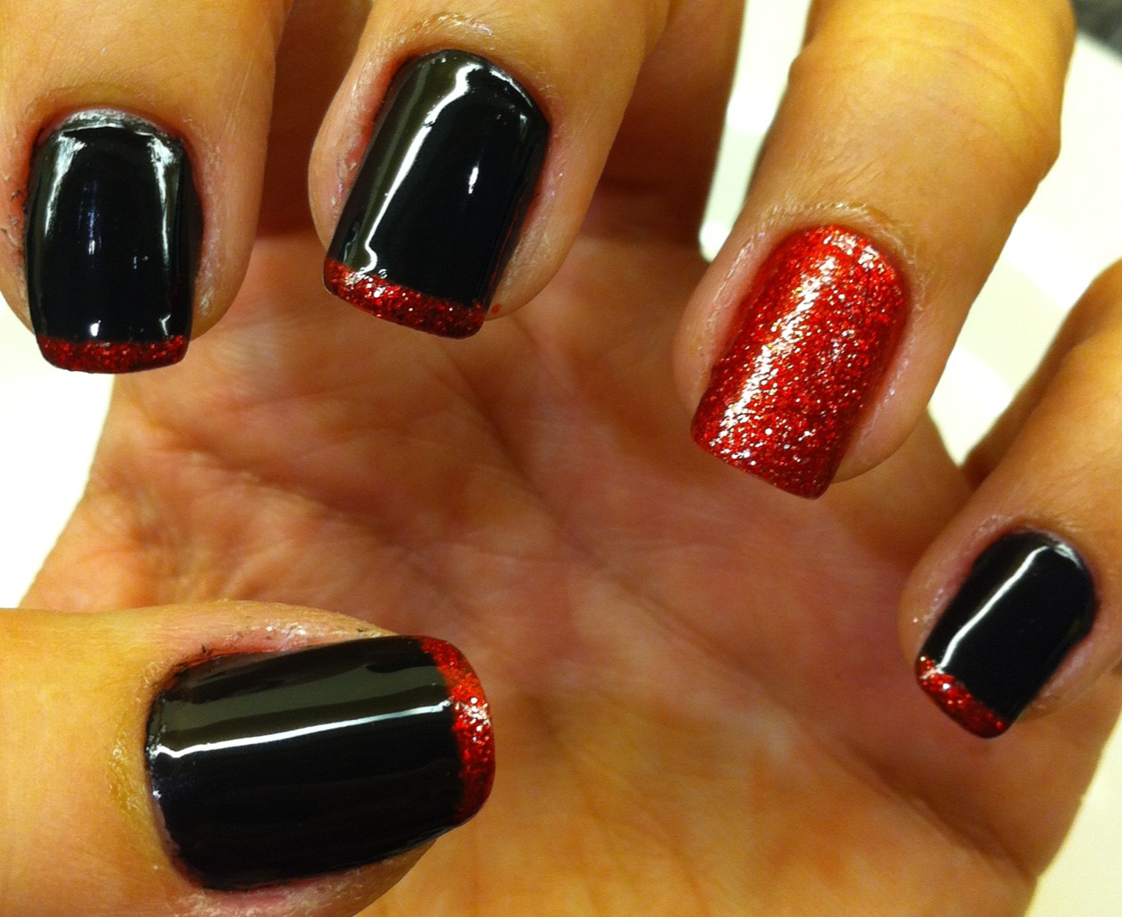 Red and black nails with glitter