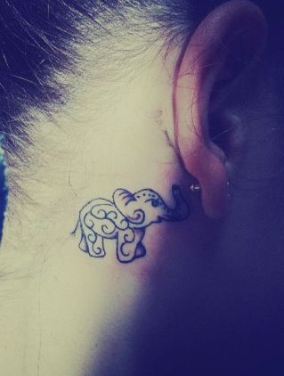 Elephant tattoo behind the ear
