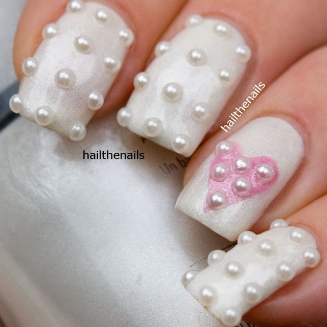 White decorated gemstone nails