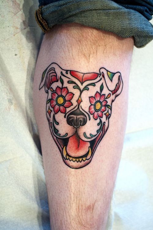 Interesting dog tattoo on the leg