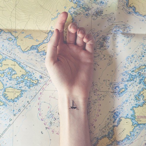 Beautiful sailboat tattoo on the wrist