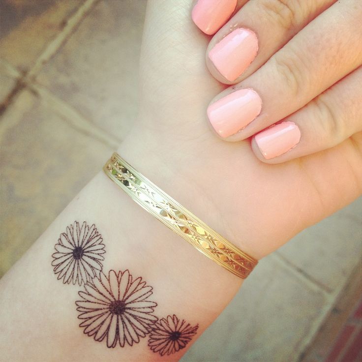 Daisy wrist tattoo