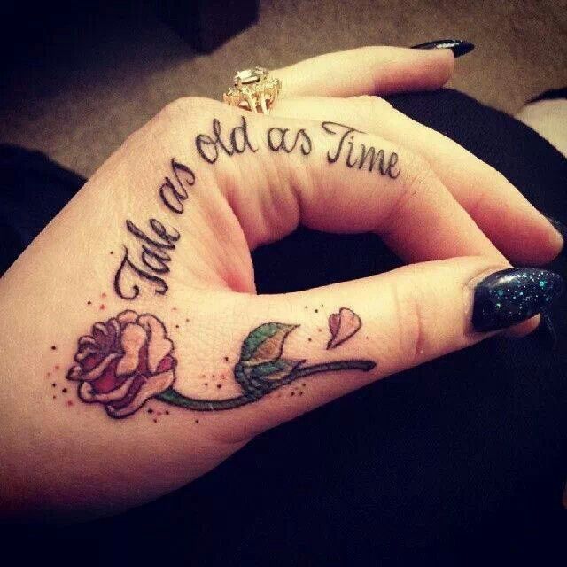 Quote and flower hand tattoo