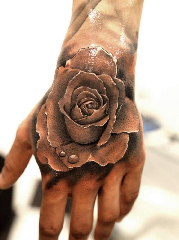 Men rose hand tattoo