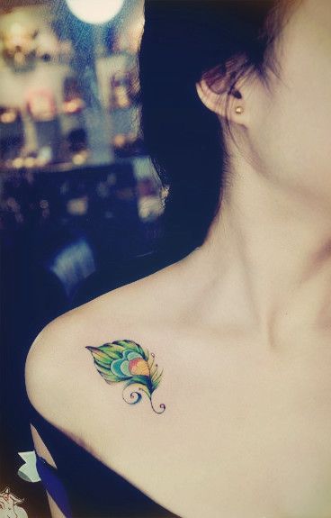 Colored feather tattoo