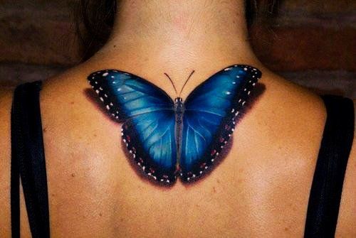Dark blue butterfly tattoo
