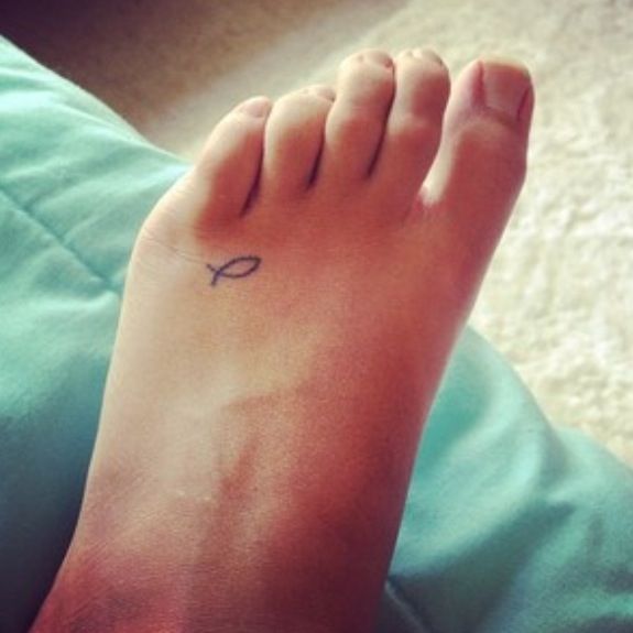 Small fish tattoo on the foot