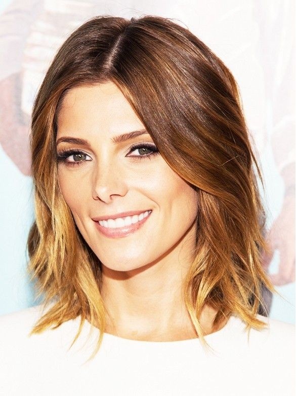 Medium length haircut with subtle waves at the ends