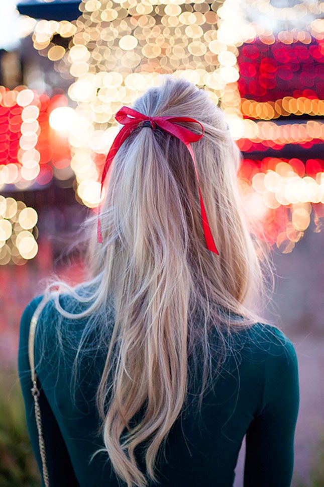 Blond hair with a red ribbon