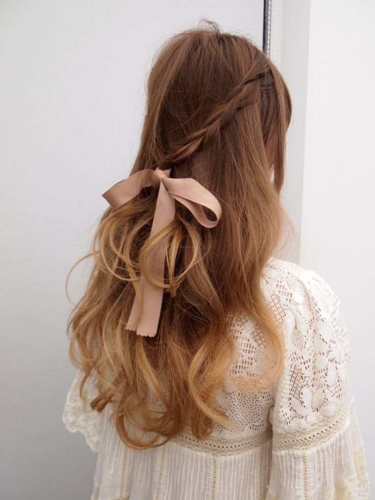 Braided half with a pink ribbon