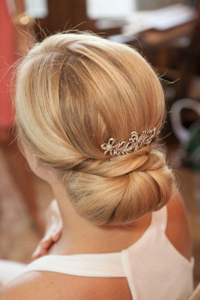 Voluminous lower updo with hair accessories