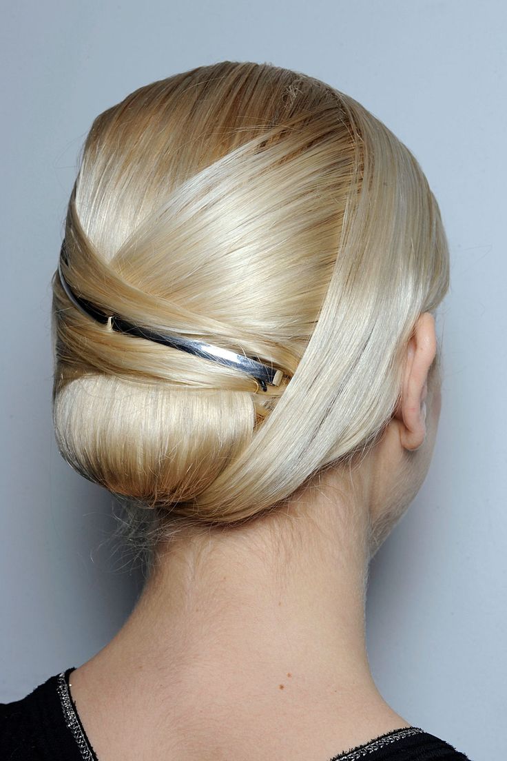 Slim updo with a metallic accessory