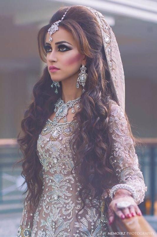 Long wavy Indian wedding hairstyle with headgear