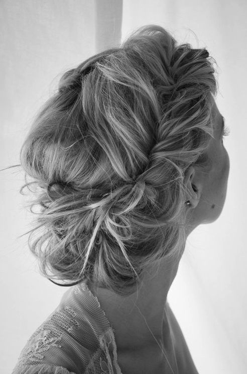 Messy braided bun hairstyle for long hair