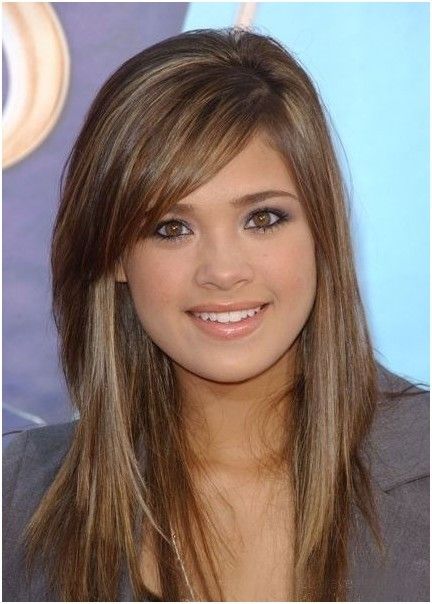 Long layered hairstyle with side-swept bangs