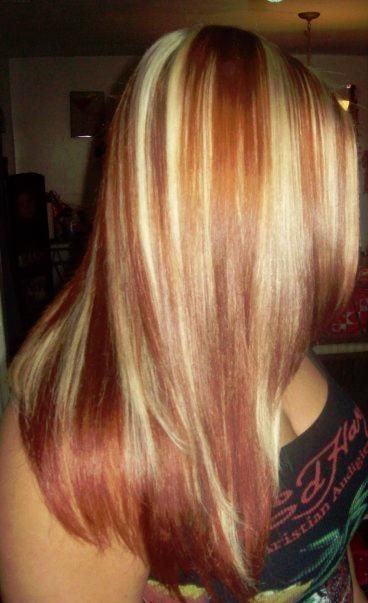 Straight blonde hair with red highlights