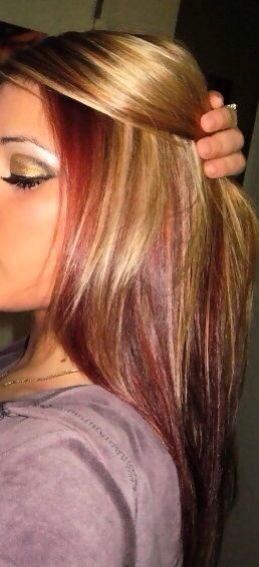 Straight blonde hair with red highlights