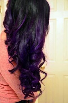 Black wavy hairstyle with purple highlights