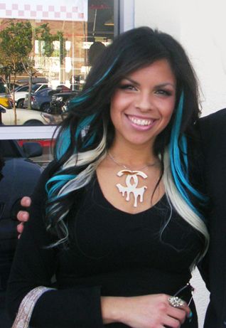 Black hair with blonde and turquoise highlights