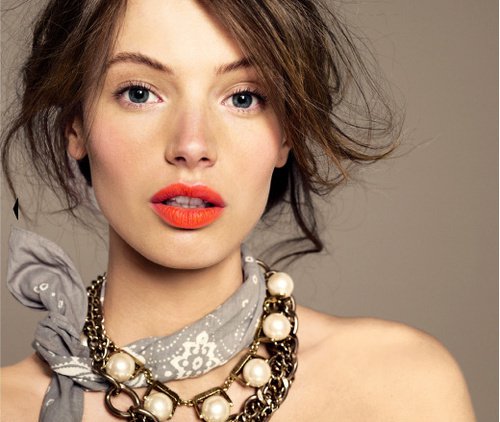 Orange lipstick makeup and messy updo