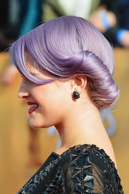 Purple colored low bun for Kelly Osbourne hairstyles