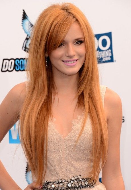 Long golden hairstyle with side-swept bangs