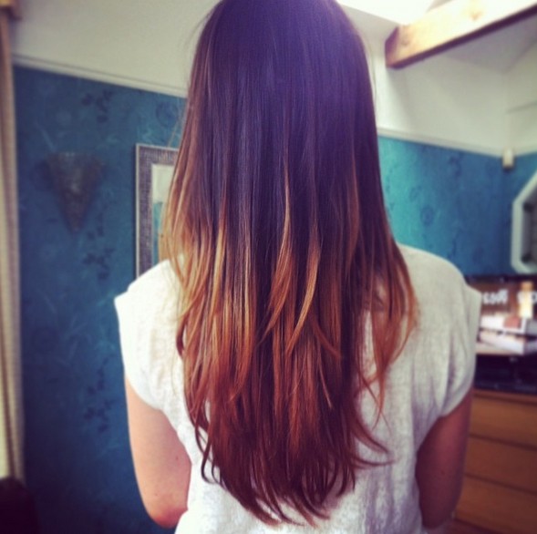 Rear view of long dark to blonde straight ombre hair for girls