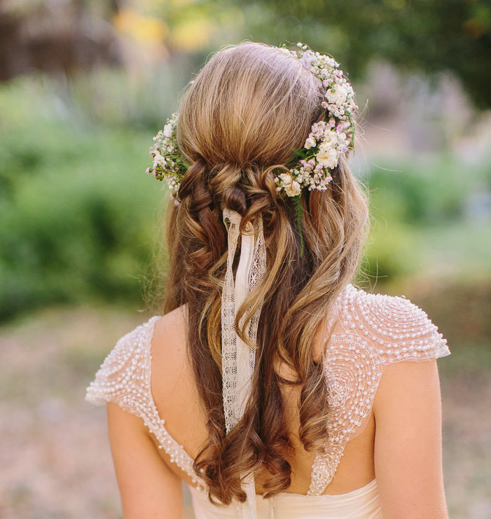 Beautiful wedding hairstyle with a flower crown