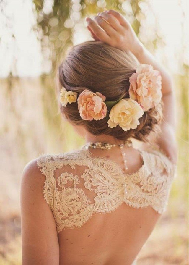 Side swept updo wedding hairstyle with flowers