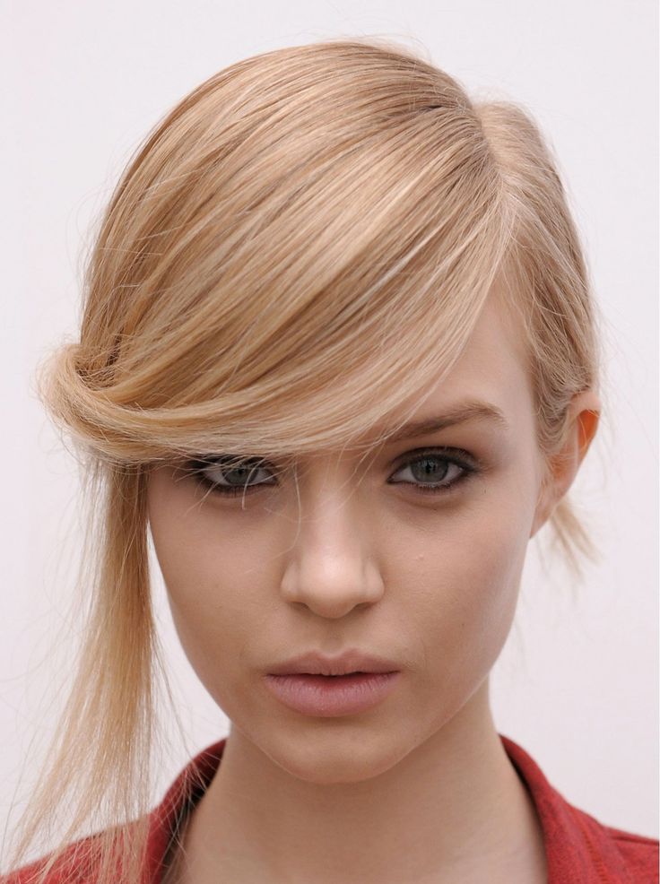Interesting side-swept hairstyle with fringes