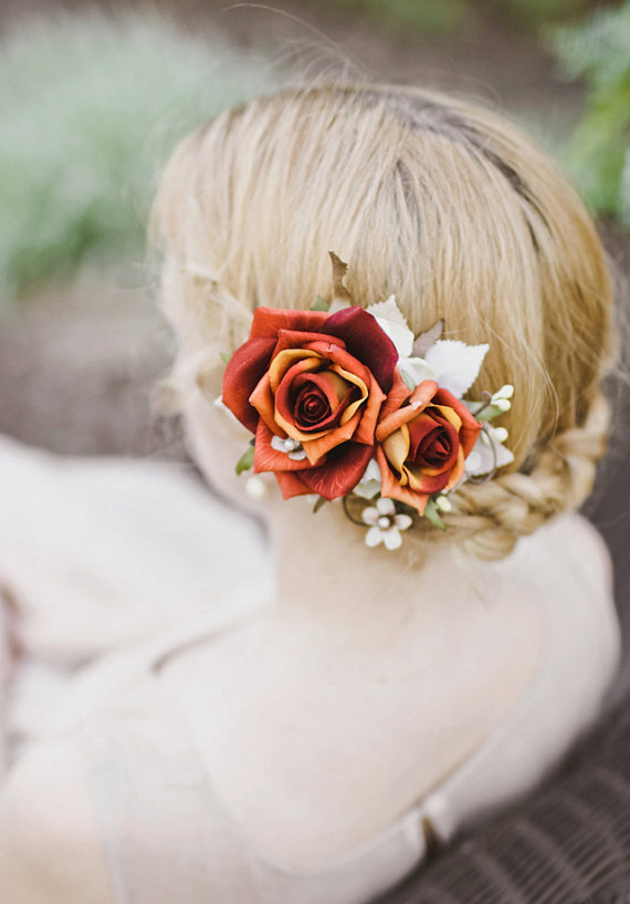 Braided bun flowers bridal hairstyle over