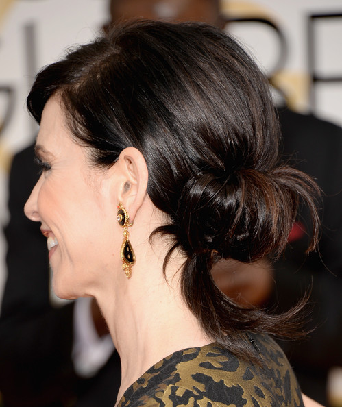 Romantic hairstyles for the lower updo for every occasion: Julianna Margulies Chignon