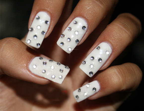 White decorated gemstone nails