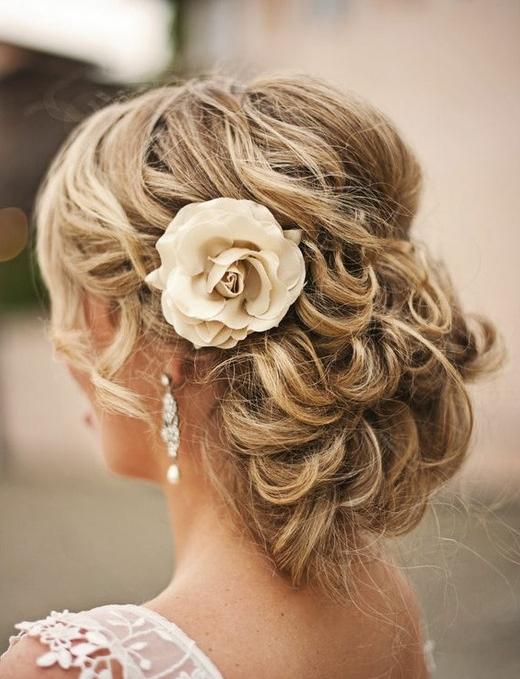 Romantic curly updo with flower