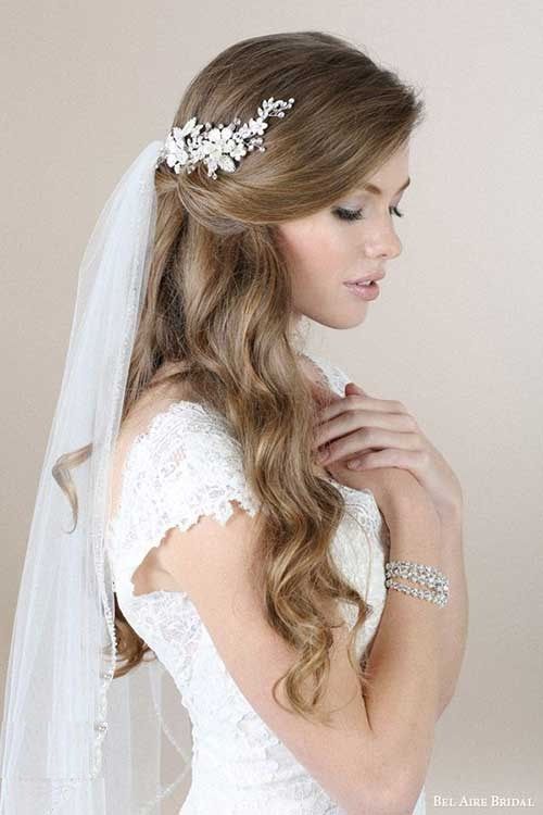Beautiful low updo hairstyle idea with fancy stone head piece hair .