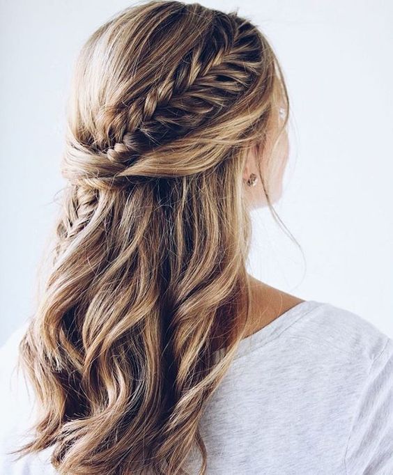 a chic half updo with waves, twists and a fishtail braid going .