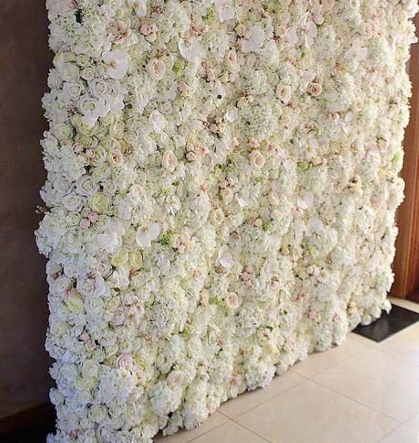 One of our latest gorgeous, easy to put reusable silk flower walls .