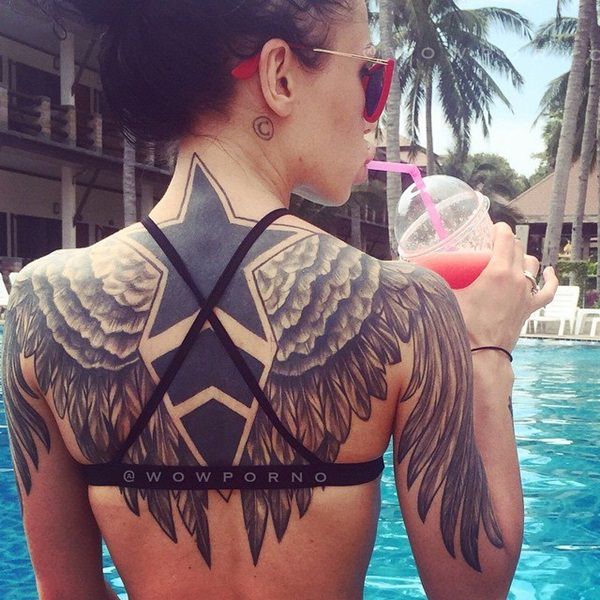 Large Angel Wings And Star Tattoos On Girl Ba