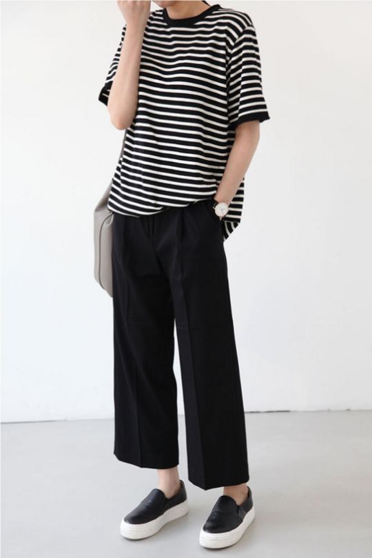Super casual black and white stripes outfit with palazzo pants .