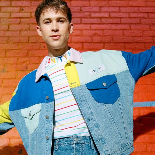 The jean jacket colors block Tommy Dorfman on one of its post .
