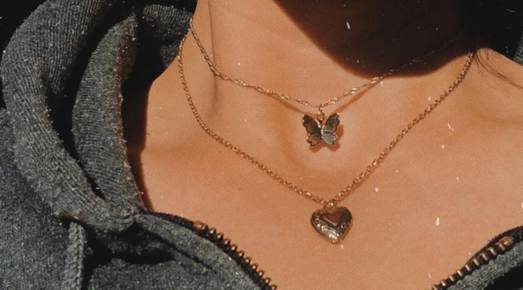 Cute layered necklace with a butterfly and a heart very simple and .
