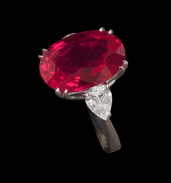 Oval Burmese Ruby Ring, 12.8 Cts. with 2.2 Cts Pear shape Diamond .