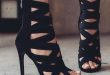 Black strappy zip up zipper strap high heels heel shoe shoes woman .