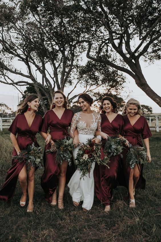 We are in love with these gorgeous burgundy silk bridesmaids .