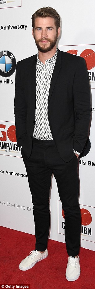 Liam Hemsworth hits the red carpet as he attends the GO Campaign .